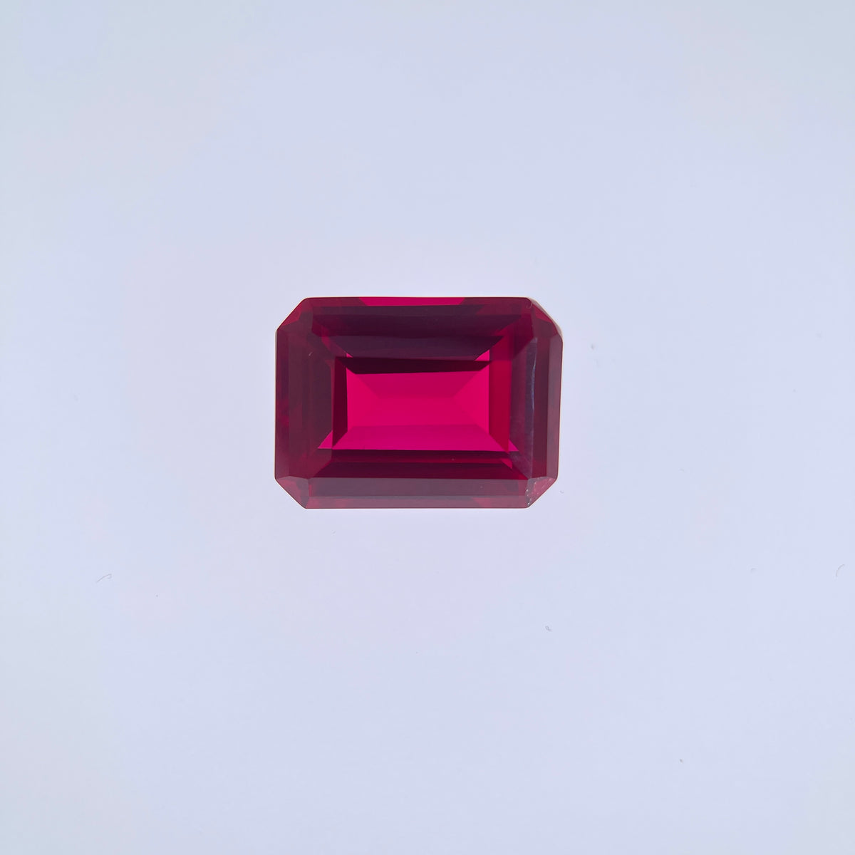 ~30ct Pigeon Blood Ruby | Emerald Cut | 1.5 × 2 cm | Gemdrop® Verified