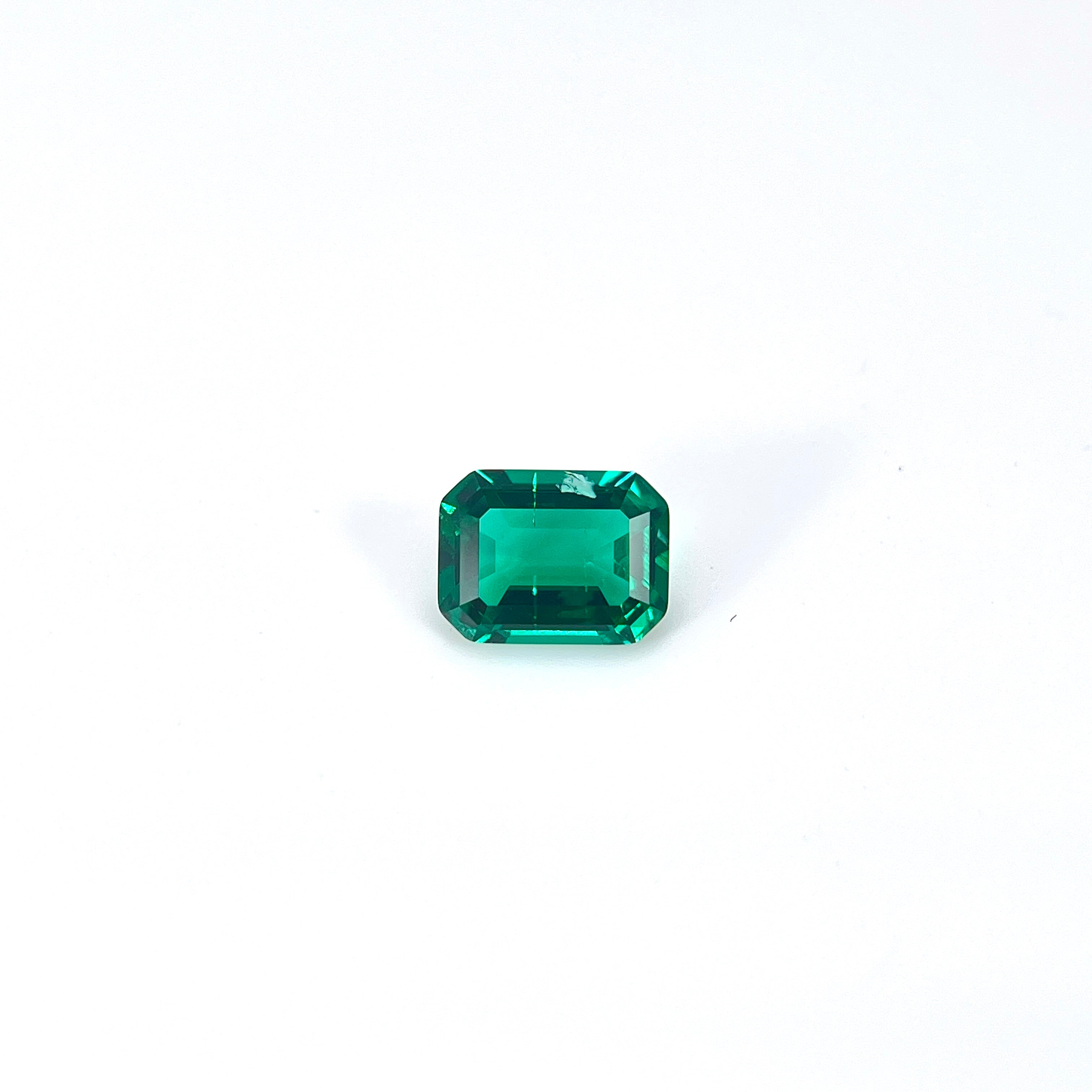 ~1.2ct Zambia Green Hydrothermal Emerald [Beryl] | Emerald Cut | 6 × 8 mm | Feather Inclusions | Gemdrop® Verified