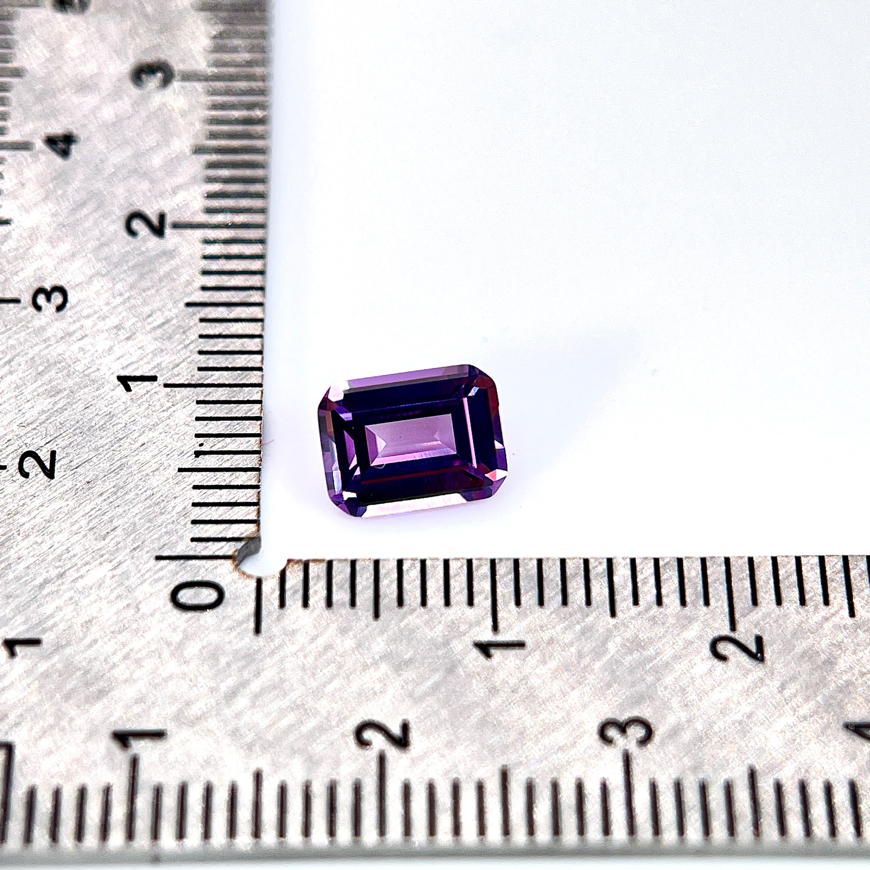 ~1.9ct Purple–Green Colour Change Corundum Alexandrite | Emerald Cut | 6 × 8 mm | Gemdrop® Verified