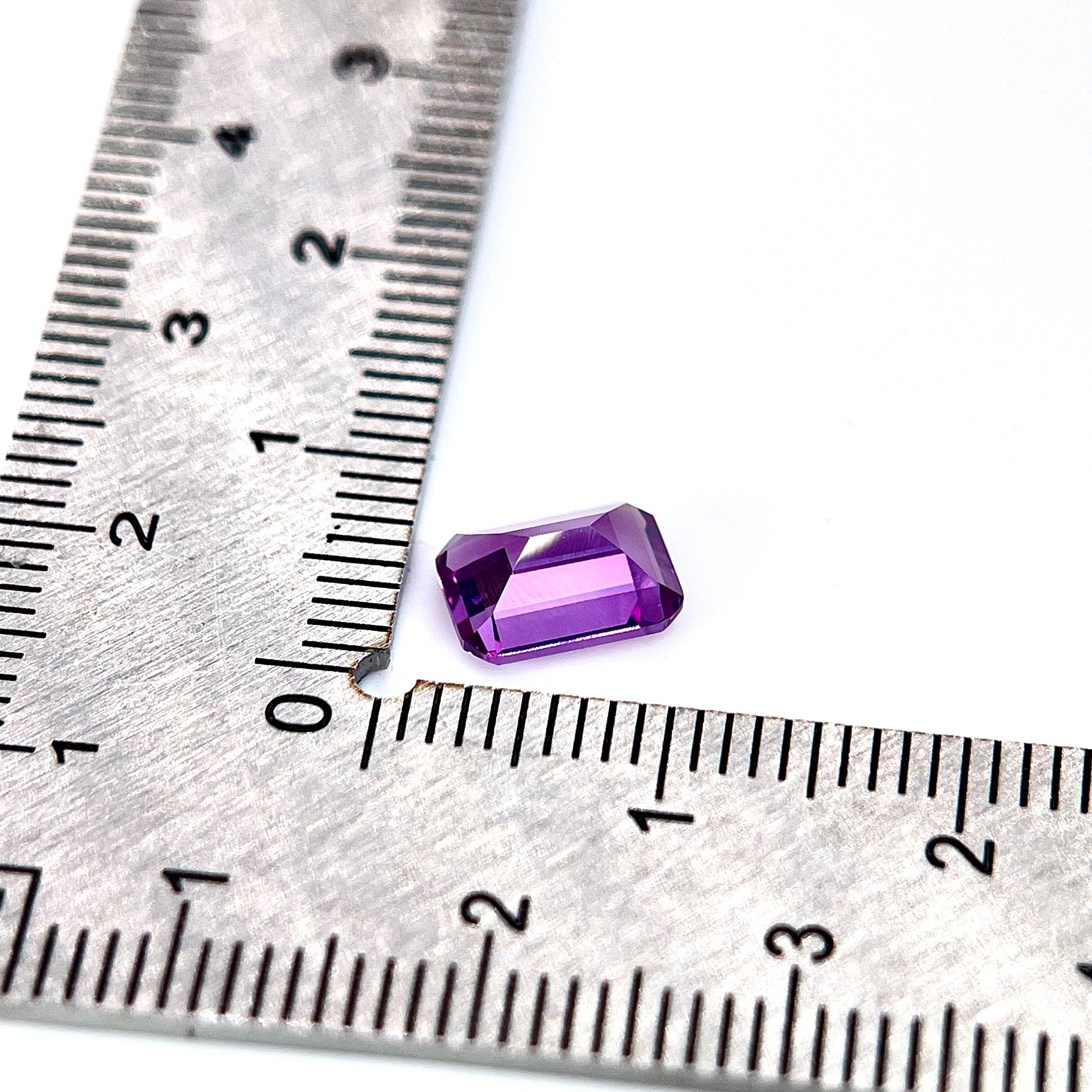 ~1.9ct Purple–Green Colour Change Corundum Alexandrite | Emerald Cut | 6 × 8 mm | Gemdrop® Verified