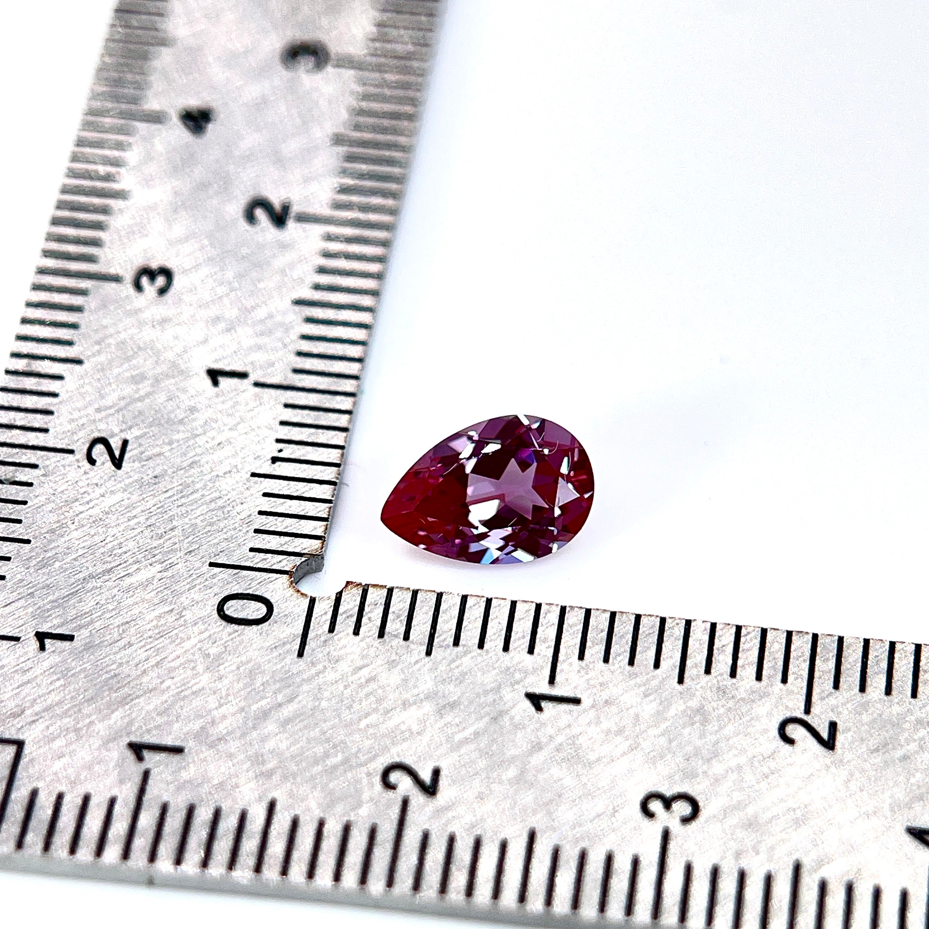 ~1.54ct Purple–Green Colour Change Alexandrite [chrysoberyl] | Drop Cut | 6 × 9 mm | Gemdrop® Verified
