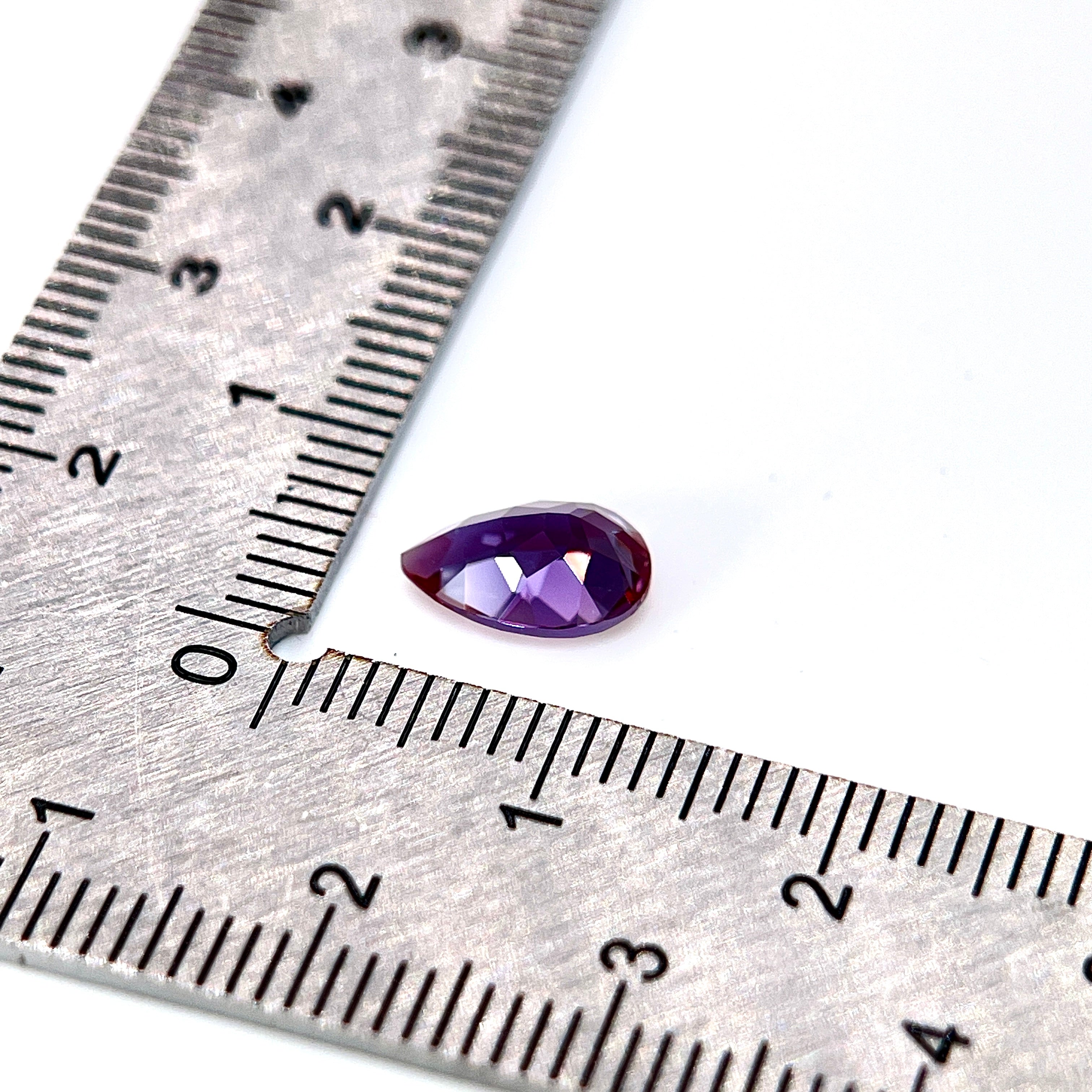 ~1.54ct Purple–Green Colour Change Alexandrite [chrysoberyl] | Drop Cut | 6 × 9 mm | Gemdrop® Verified