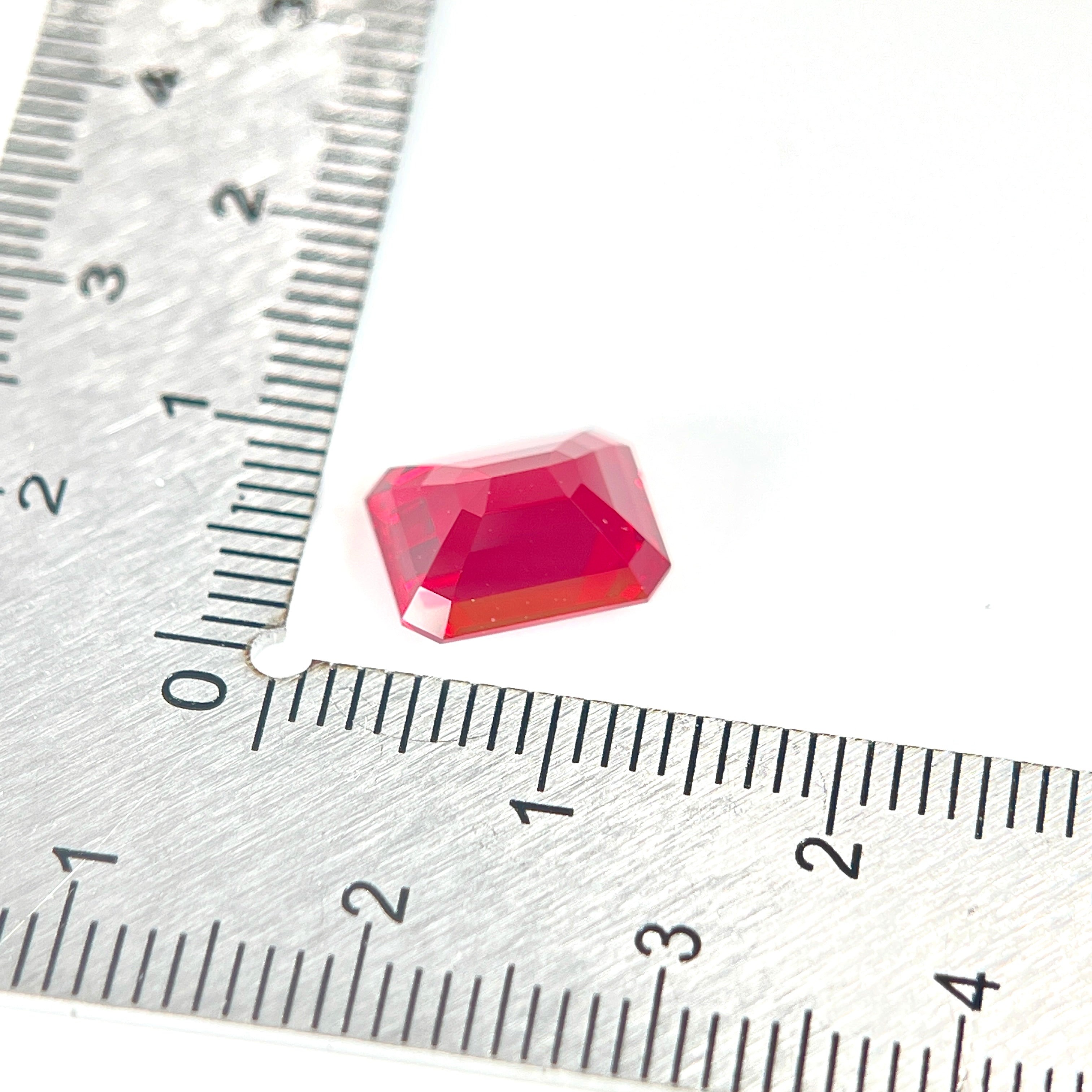 ~4.19ct Pigeon Blood Red Czochralski Sapphire | Emerald Cut | 8 × 10 mm | Gemdrop® Verified